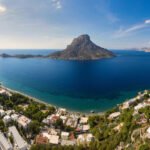 Panoramic landscape of Telendos island in distance and part of Kalymnos island, Massouri, Greece